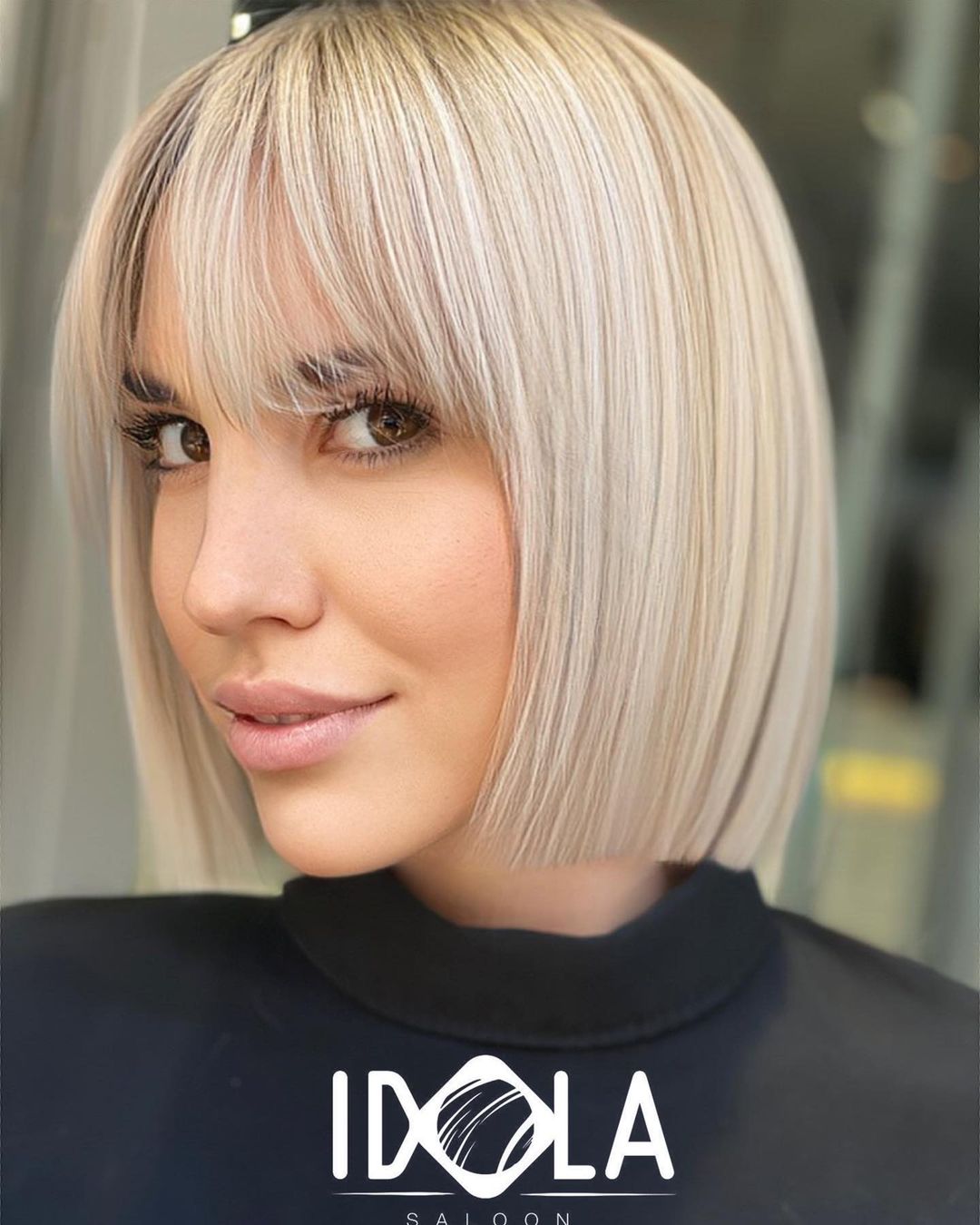 Sleek Blunt Blonde Bob with a Fringe